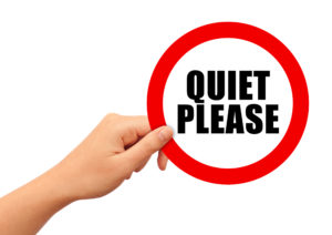 Red circle with text reading "Quiet Please"