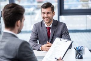 Man smiling in a job interview