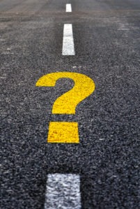 Yellow question mark painted on road lines